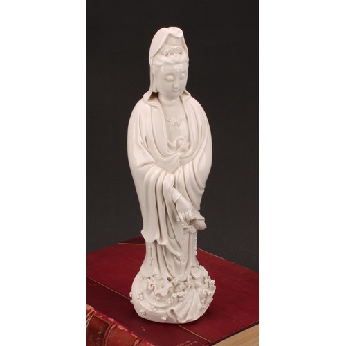 201 - A Chinese blanc de chine figure, Guanyin, 33cm high