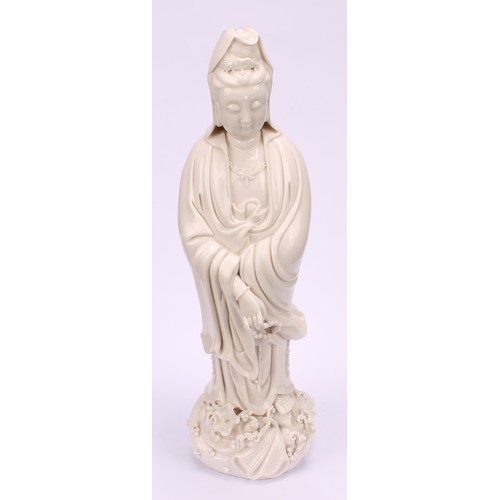 201 - A Chinese blanc de chine figure, Guanyin, 33cm high