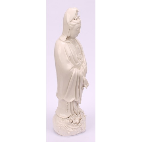 201 - A Chinese blanc de chine figure, Guanyin, 33cm high