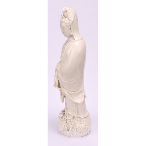 201 - A Chinese blanc de chine figure, Guanyin, 33cm high