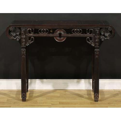 1227 - A Chinese hardwood altar table, rectangular top with scroll ends terminating in stylised clouds, the... 