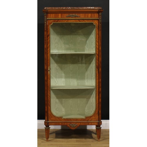 1420 - A Louis XV Revival gilt metal mounted pier vitrine, marble top above a glazed door enclosing two she... 