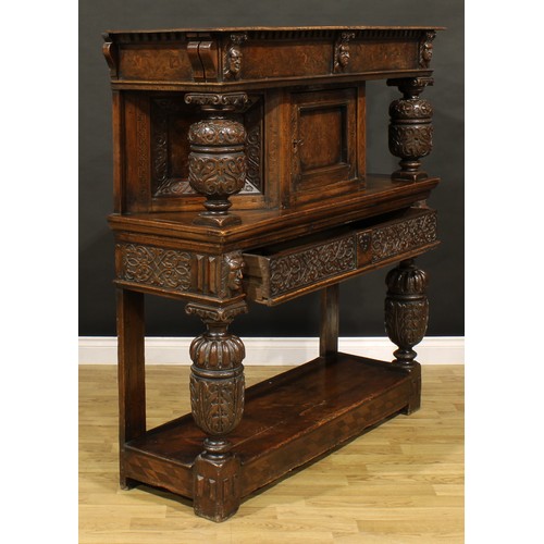 1313 - A 17th century style oak and marquetry duodarn, rectangular top with dentil capital and a frieze inl... 