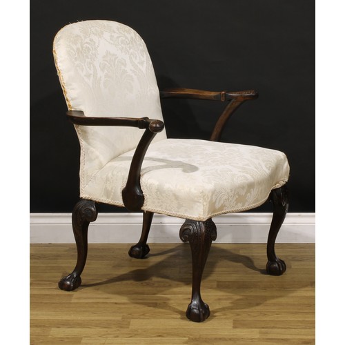 1238 - A George II Revival mahogany elbow chair, stuffed-over upholstery, outswept arms and cabriole legs c... 