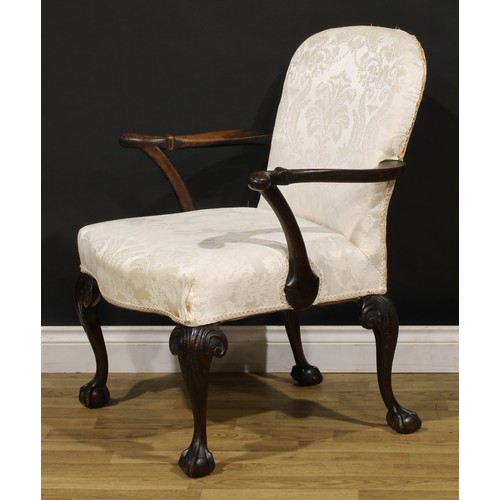 1238 - A George II Revival mahogany elbow chair, stuffed-over upholstery, outswept arms and cabriole legs c... 