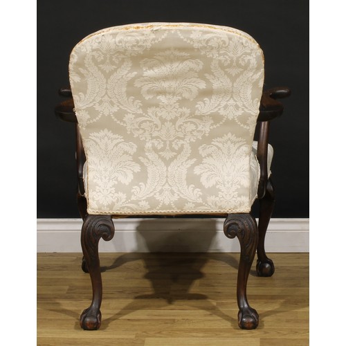 1238 - A George II Revival mahogany elbow chair, stuffed-over upholstery, outswept arms and cabriole legs c... 