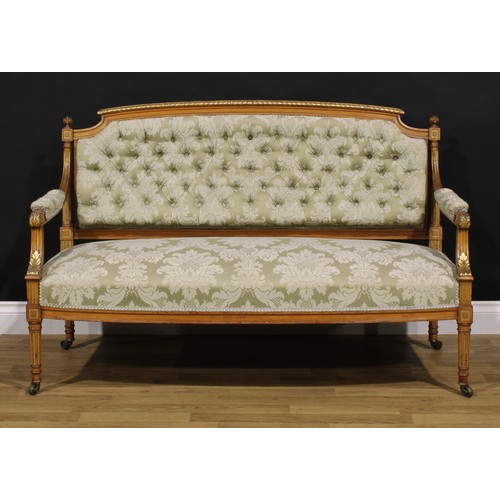 1531 - A Louis XVI Revival parcel-gilt canape or sofa, stuffed-over upholstery, fluted tapered cylindrical ... 