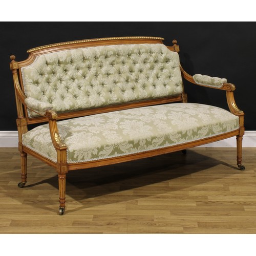 1531 - A Louis XVI Revival parcel-gilt canape or sofa, stuffed-over upholstery, fluted tapered cylindrical ... 