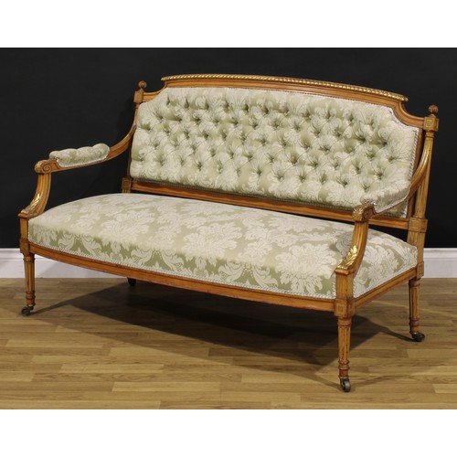 1531 - A Louis XVI Revival parcel-gilt canape or sofa, stuffed-over upholstery, fluted tapered cylindrical ... 