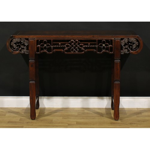 1226 - A Chinese hardwood altar table, rectangular top with scroll ends carved with branches terminating in... 