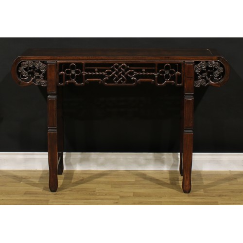 1226 - A Chinese hardwood altar table, rectangular top with scroll ends carved with branches terminating in... 