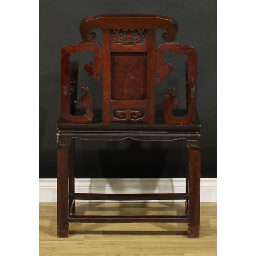 1398 - A Chinese hardwood Taishi armchair, shaped cresting rail terminating in ruyi-form ends, panel back a... 