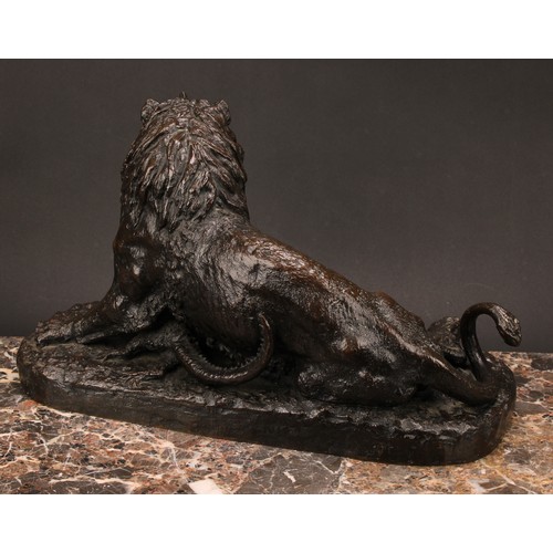 1572 - After Christophe Fratin (1801 - 1864), a brown patinated animalier bronze, lion grasping an alligato... 