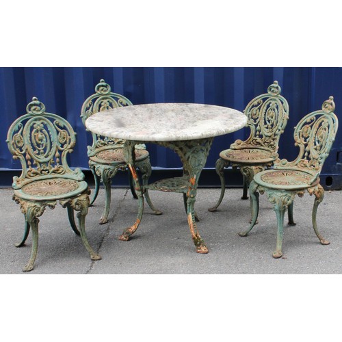 1463 - A Victorian cast iron composed garden suite, comprising a set of four chairs and a table, the chair ... 