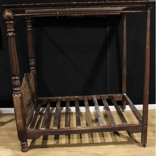 1872 - A William IV mahogany four-poster bed, outswept cornice, the headboard columns carved with stylised ... 