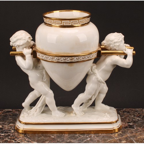 33 - A late 19th century Mintons porcelain figural table centrepiece, modelled as two partially-draped pu... 