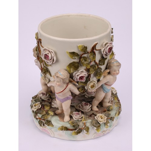 150 - A pair of Sitzendorf porcelain cache pots, each supported by four cherubs, the shaped circular base ... 