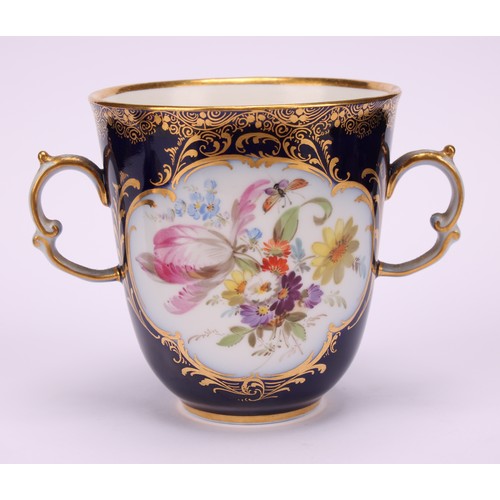 131 - A Continental porcelain trembleuse two-handled chocolate cup and cover, painted with courting couple... 