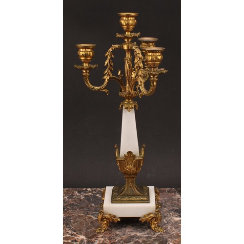 1245 - A pair of Louis XVI style gilt metal mounted three branch four light candelabra, 38cm high