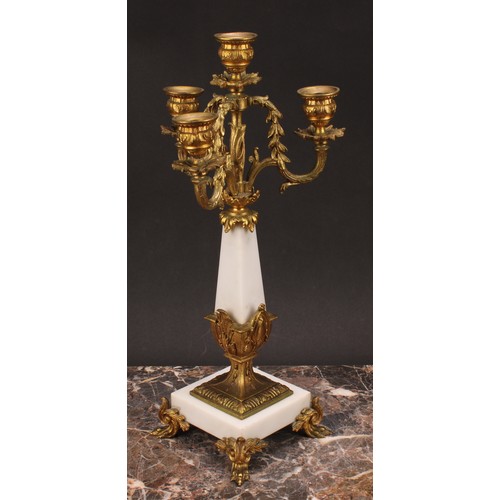 1245 - A pair of Louis XVI style gilt metal mounted three branch four light candelabra, 38cm high