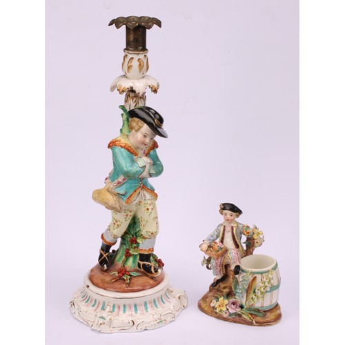 31 - A John Bevington porcelain figural candlestick, allegorical of Winter, as a skater with turquoise ja... 