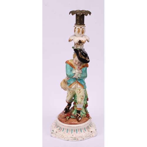 31 - A John Bevington porcelain figural candlestick, allegorical of Winter, as a skater with turquoise ja... 