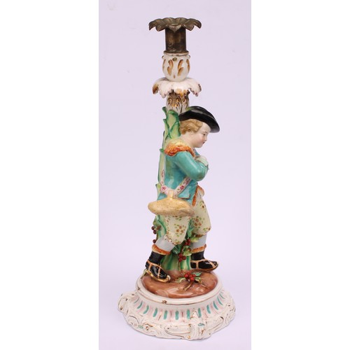 31 - A John Bevington porcelain figural candlestick, allegorical of Winter, as a skater with turquoise ja... 