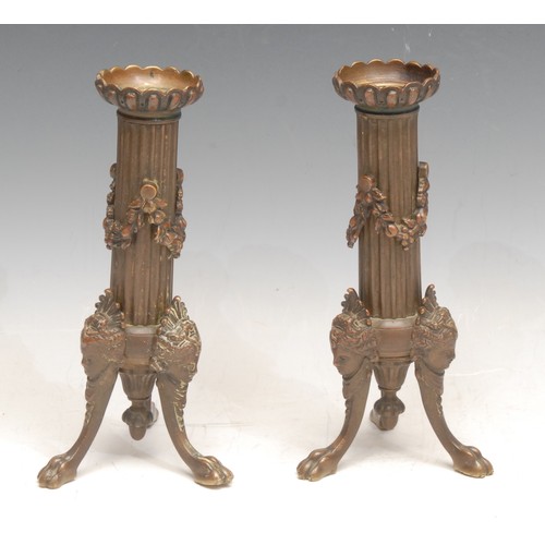 1244 - A pair of Louis XVI Revival bronze candlesticks, the tripod supports cast with Venus masks, 18cm hig... 