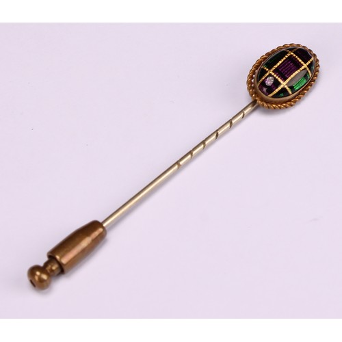 970 - Stick Pins - a 9ct gold flowerhead stick pin, illusion set with a single stone; a 9ct Three Legs of ... 