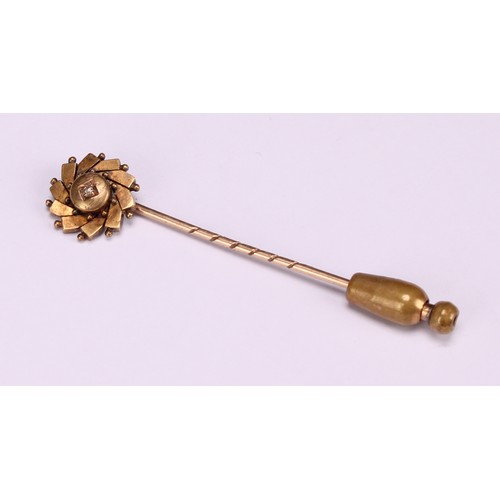 970 - Stick Pins - a 9ct gold flowerhead stick pin, illusion set with a single stone; a 9ct Three Legs of ... 