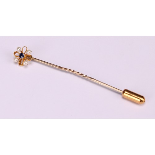 970 - Stick Pins - a 9ct gold flowerhead stick pin, illusion set with a single stone; a 9ct Three Legs of ... 