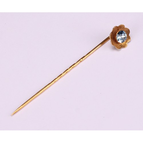 970 - Stick Pins - a 9ct gold flowerhead stick pin, illusion set with a single stone; a 9ct Three Legs of ... 