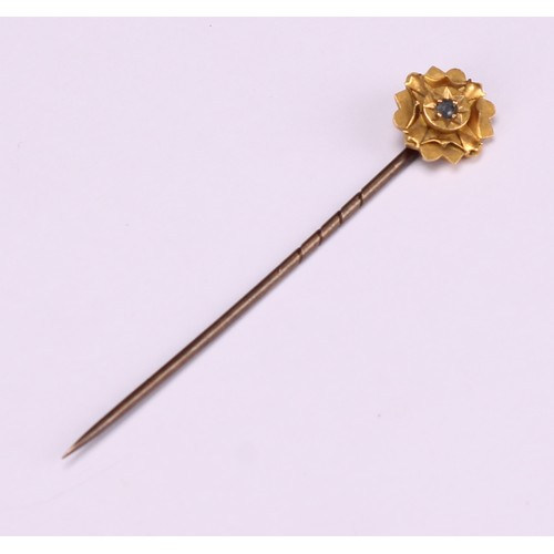 970 - Stick Pins - a 9ct gold flowerhead stick pin, illusion set with a single stone; a 9ct Three Legs of ... 