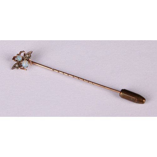 980 - Stick Pins - An Essex rock crystal reverse intaglio stick pin, decorated with a fox mask, rope twist... 