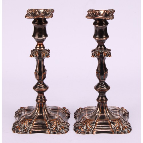 555 - A pair of William IV Old Sheffield Plate tapersticks, detachable nozzles, knopped pillars, fluted ss... 