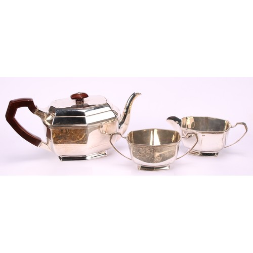 673 - A George VI silver three piece tea service, comprising teapot, cream jug and sugar basin, Charles S ... 