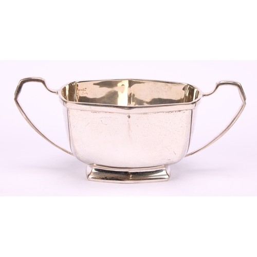 673 - A George VI silver three piece tea service, comprising teapot, cream jug and sugar basin, Charles S ... 