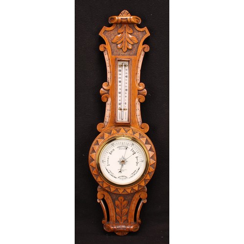 1209 - A late Victorian oak wheel barometer, 12cm circular register inscribed JOHNSON & SON., DERBY, the ca... 