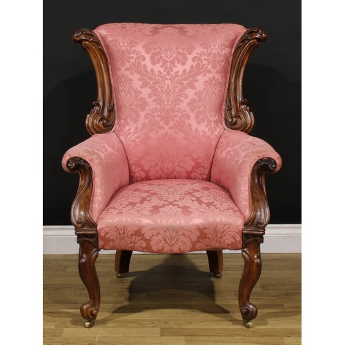 1443 - A Victorian walnut drawing room chair, possibly Scottish, carved throughout with scrolling acanthus,... 