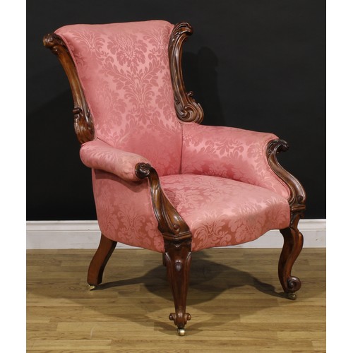 1443 - A Victorian walnut drawing room chair, possibly Scottish, carved throughout with scrolling acanthus,... 