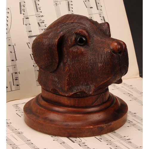 1182 - A large Black Forest novelty inkwell, carved as the head of a dog, hinged cover, glass eyes, turned ... 