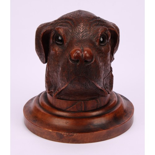 1182 - A large Black Forest novelty inkwell, carved as the head of a dog, hinged cover, glass eyes, turned ... 