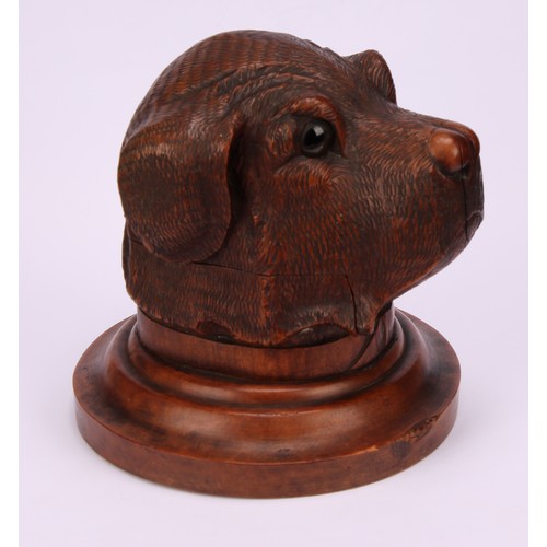 1182 - A large Black Forest novelty inkwell, carved as the head of a dog, hinged cover, glass eyes, turned ... 