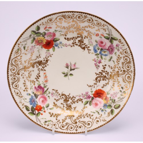 42 - A Swansea or Nantgarw circular dished plate, painted with colourful summer flowers, within a broad e... 