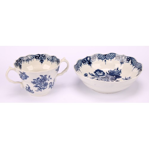 90 - A Worcester Three Flowers pattern ogee shaped chocolate cup and saucer, in underglaze blue, serpent ... 