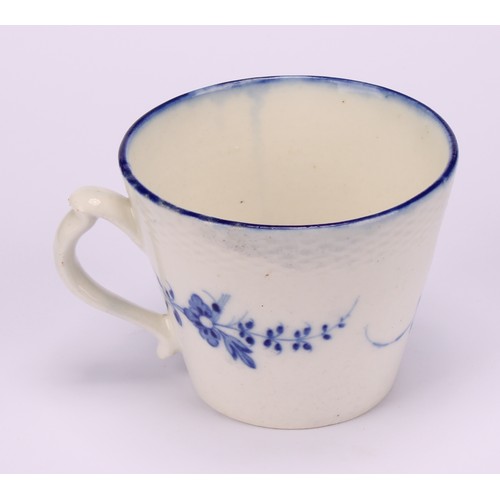 29 - A Caughley Chantilly Sprig pattern coffee cup, in underglaze blue, kick handle, 6cm high; a Caughley... 