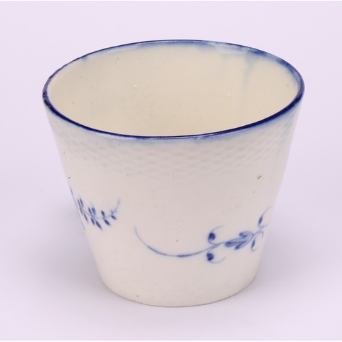 29 - A Caughley Chantilly Sprig pattern coffee cup, in underglaze blue, kick handle, 6cm high; a Caughley... 