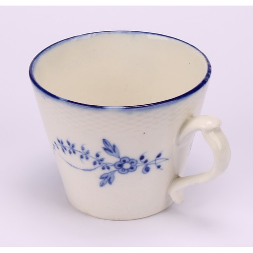 29 - A Caughley Chantilly Sprig pattern coffee cup, in underglaze blue, kick handle, 6cm high; a Caughley... 