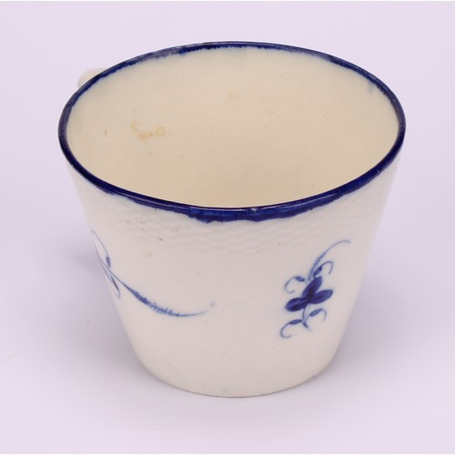 29 - A Caughley Chantilly Sprig pattern coffee cup, in underglaze blue, kick handle, 6cm high; a Caughley... 