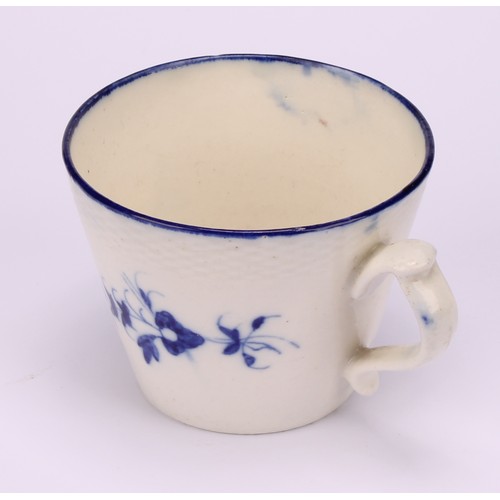 29 - A Caughley Chantilly Sprig pattern coffee cup, in underglaze blue, kick handle, 6cm high; a Caughley... 